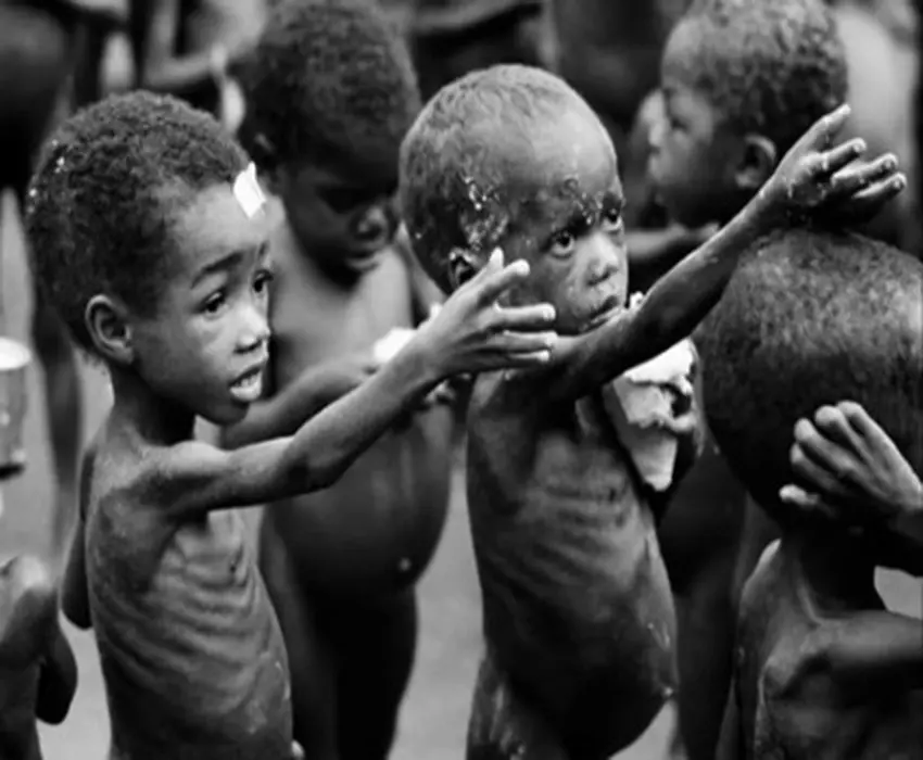 Starving Black boys with their hands out begging for something to eat