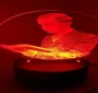 A red tinted image of Master Fard Muhammad inside a light bulb.
