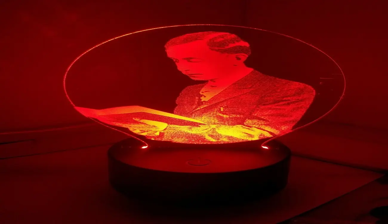 A red tinted image of Master Fard Muhammad inside a light bulb.