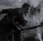 An enslaved Black man running on the battlefield fighting for his freedom 