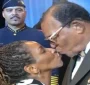 Louis Farrakhan kissing Stephanie Mills