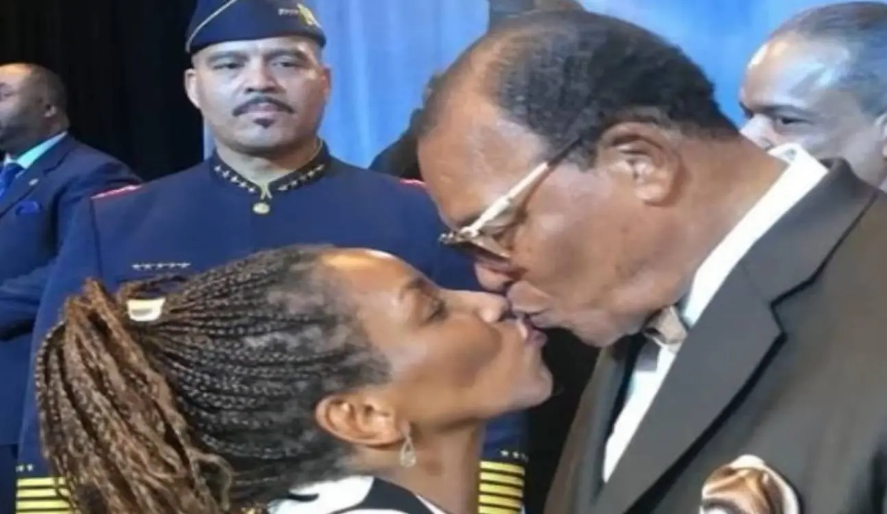 Louis Farrakhan kissing Stephanie Mills